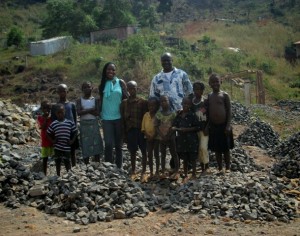 Foday & Joy with kids at stone mine